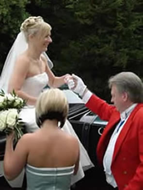 Richard Palmer Wedding Toastmaster assisting a bride from a horse drawn carraige